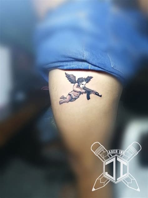 Cupid With Ak47 Black And Grey Tattoo By Jaber Ink Cupid Tattoo