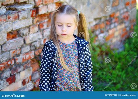Sad Toddler Girl Standing Near Brick Wall Stock Photo Image Of Angry