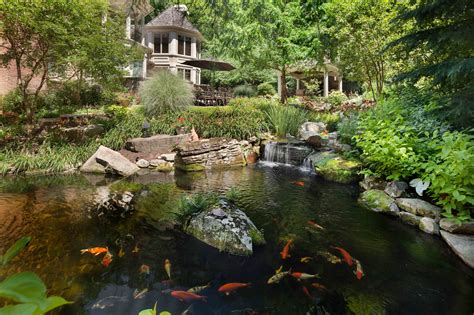 Whenever i visit a backyard pond, i'm always struck by how unique and personal each pond is. This Koi pond is fed by two waterfalls and serpentine ...