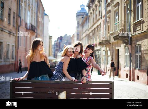Four Beautiful Girls Posing In Front Of In The City Stock Photo Alamy