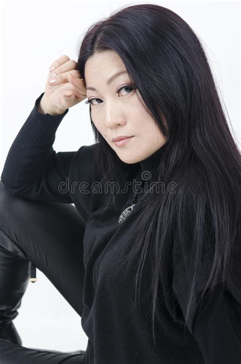 Young Beautiful Asian Girl On A Dark Background Stock Photo Image Of