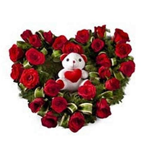 Heart Shape Arrangement Of 50 Red Roses With Teddy
