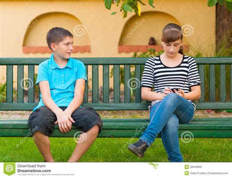 Teenage Boy Looking With Love At Indifferent Girl Stock Photo Image 26546800