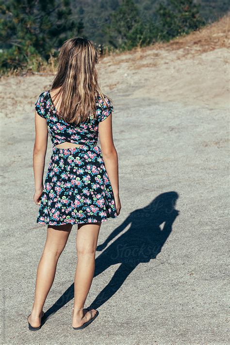 Back View Of A Teen Girl In A Summer Dress And Her Shadow By Carolyn