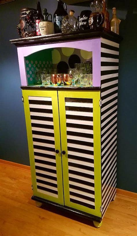 Hand Painted Cabinet That Is Perfect For Storage And For Entertaining