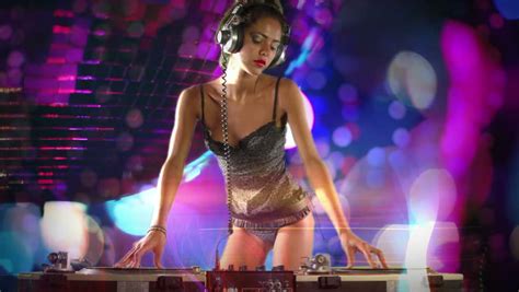 A Sexy Female Dj Dancing And Playing Records With Disco Style