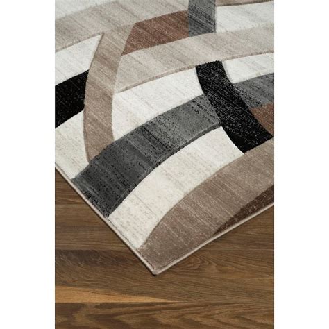 Signature Design By Ashley Contemporary Area Rugs R402921 Jacinth Brown