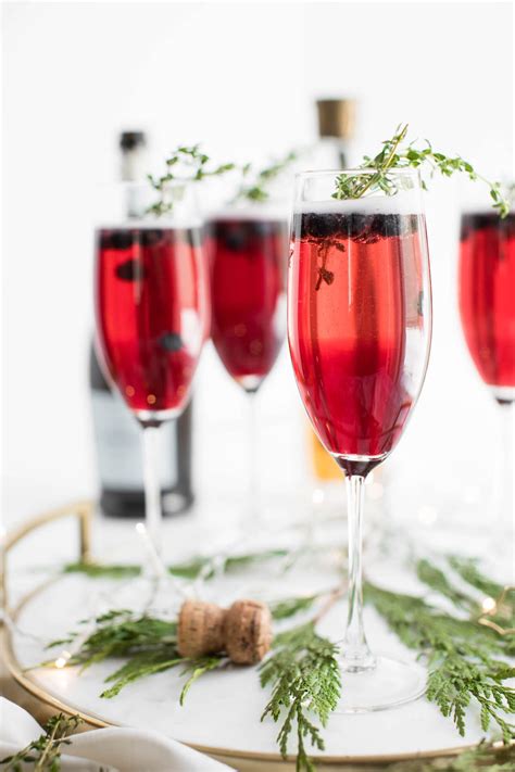 A look at what components make up the 2020 champaign christmas lights show. Raise a Glass with these Blueberry and Thyme Champagne Cocktails - The Sweetest Occasion