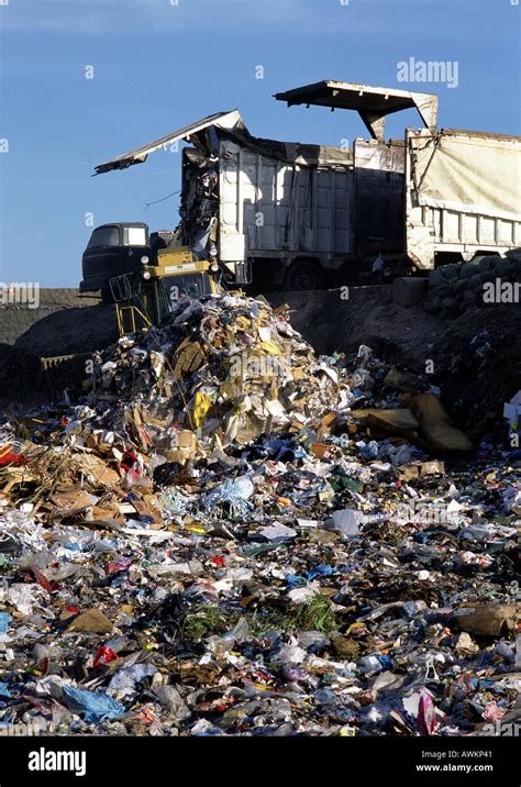 Truck Dumping Trash In Landfill Stock Photo Alamy