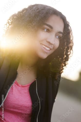 Beautiful Mixed Race African American Girl Teenager At Sunset Stock
