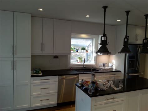 I ended up having to have all the cabinets repainted. White and Black Shaker Kitchen, Stamford, CT ...