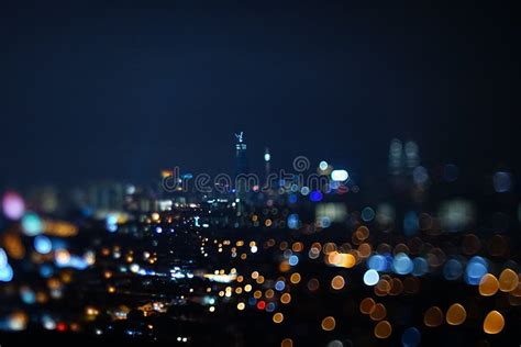 Blurred Dramatic Night View Of City With Abstract Of Led Neon Lights
