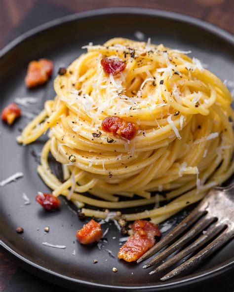spaghetti carbonara is a roman style pasta that s rich in flavor and texture crispy guanciale