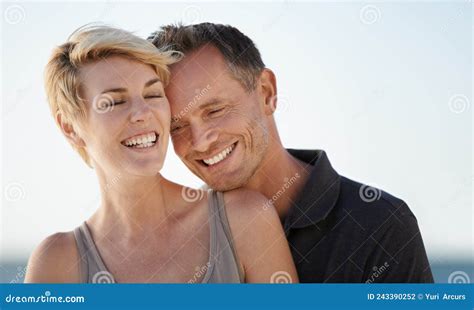 Making Each Other Laugh Shot Of A Mature Couple Enjoying A Day At The