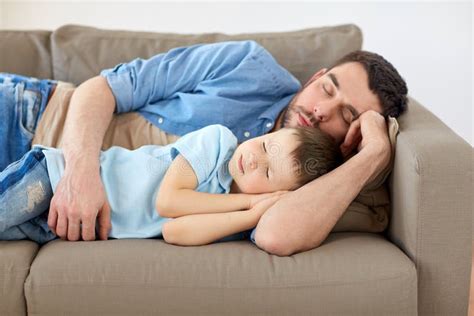 Happy Father And Son Sleeping On Sofa At Home Stock Image Image Of
