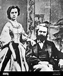 Marx's daughter Jenny Longuet standing and Karl Marx seated ...