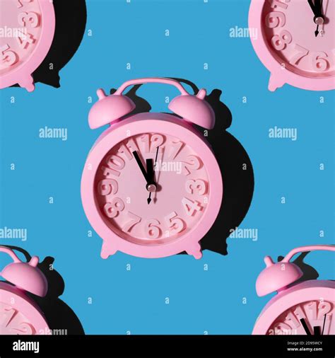 Fashionable Pattern With A Pink Clock On A Blue Background Repeating