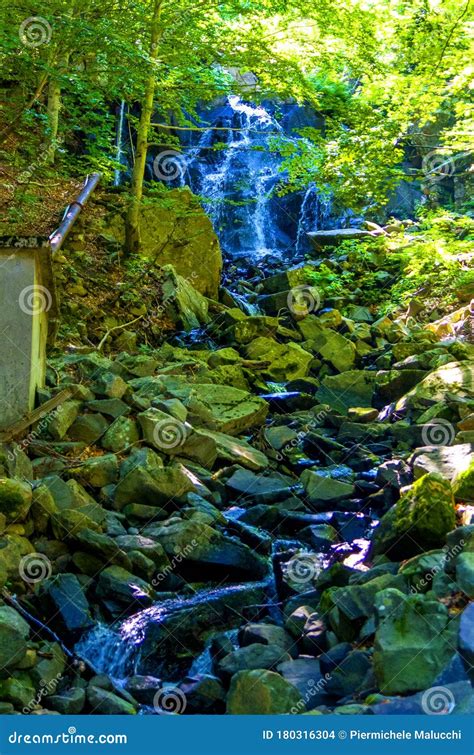 Mountain Stream Waterfall With Pure And Clear Water Running Fast