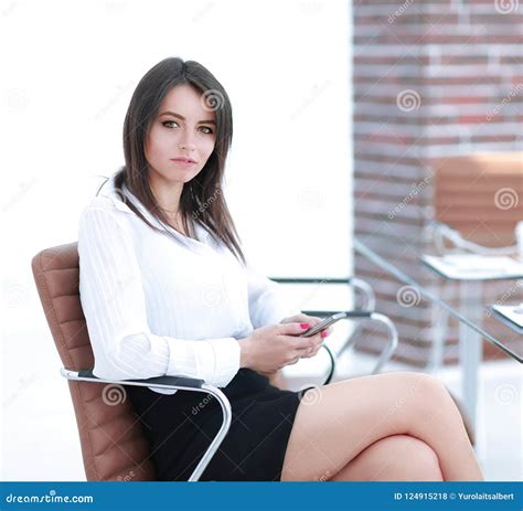 Successful Modern Business Woman Sitting At A Desk Royalty Free Stock