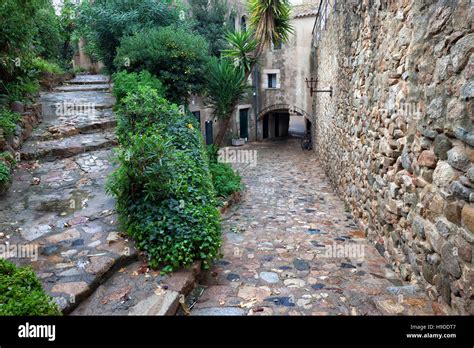 Spain Tossa De Mar Cobbled Street Staircase And Stone Wall In