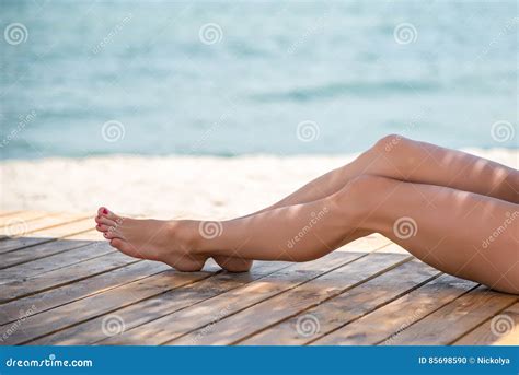 Woman S Beautiful Legs On The Beach Stock Photo Image Of Pleasure
