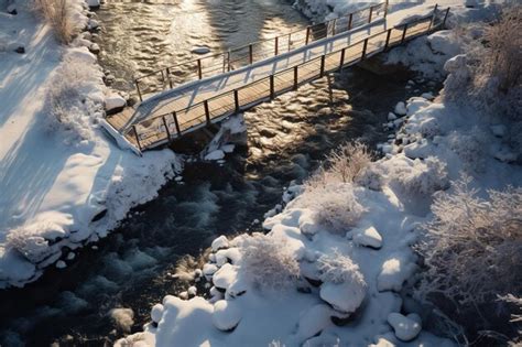 Premium Ai Image A Small Snow Covered Bridge Crossing Over The River