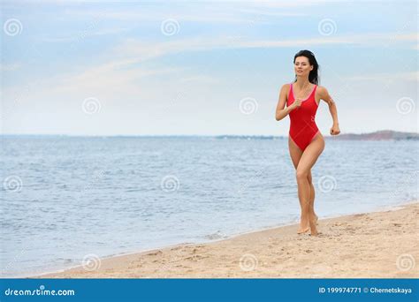 Beautiful Female Lifeguard Running At Sandy Beach Stock Image Image Of Caution Adult 199974771