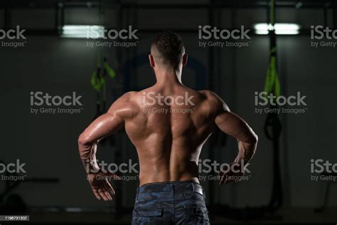 Muscular Body Builder Showing His Back Lat Spread Stock Photo