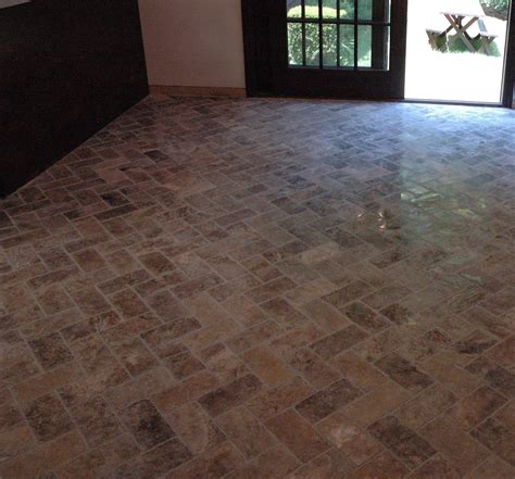 Tile floors are a natural choice for kitchens. Custom Bathroom Remodeling: Natural Stone Herringbone Tile Floor