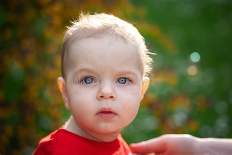 Closeup Portrait Of Baby Boy With Big Eyes Serious Little Boy With