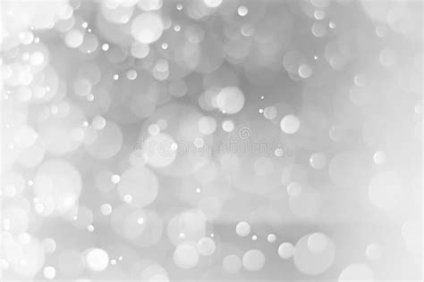 Silver And White Bokeh Lights Defocused Blurred Background Stock Photo