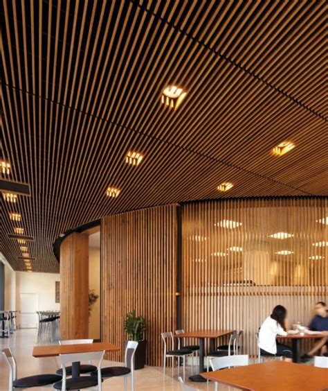 One of the most visually effective types of ceiling design allows you to effectively emphasize the status and aesthetic taste of the owner. edge wood ceiling structure, filtering ceiling above, with ...