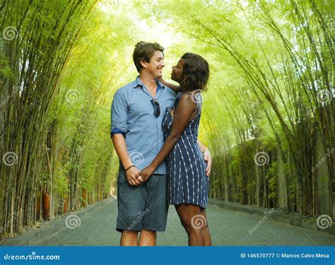Tender Mixed Ethnicity Couple Cuddling Outdoors With Attractive Black Afro American Woman And