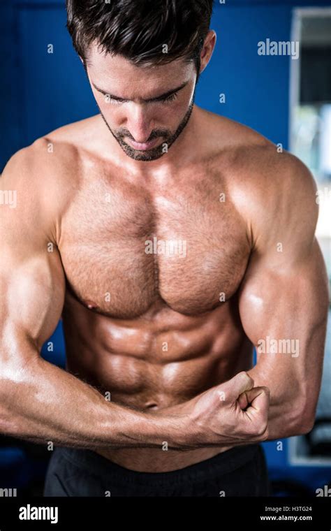 Male Athlete Flexing Muscles Stock Photo Alamy
