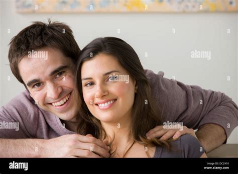 Portrait of couple, man with hand on woman's shoulder Stock Photo - Alamy