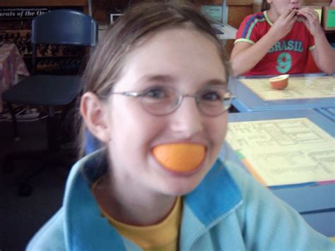 Putting An Orange Peel In Your Mouth To Make Your Smile Orange
