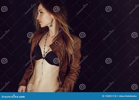 Model Wearing Leather Jacket And Black Skirt Posing Fashion In The