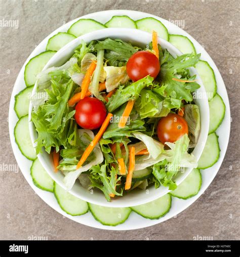 Bowl Of Salad With Tomato S And Carrot Inside A Plated Ring Cucumber