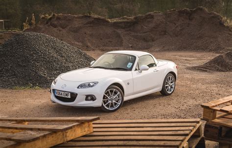 By sending power to the rear wheels and letting the front wheels do the steering, you truly. Mazda MX-5 Review - 2014 Sport Coupe Reviewed by Motor Verso