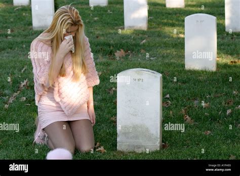 Woman crying grave hi-res stock photography and images - Alamy