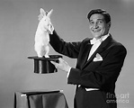 Magician Pulling Rabbit Out Of Hat Photograph by H. Armstrong Roberts ...
