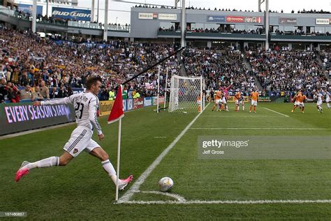 David Beckham Of Los Angeles Galaxy Kicks A Corner Kick While Taking