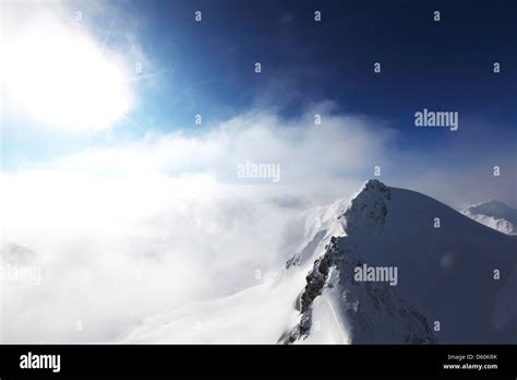 Top Of Alps In Sky Stock Photo Alamy