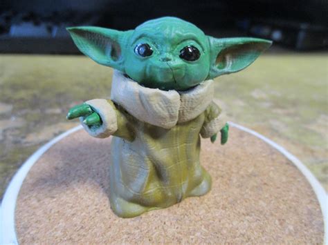 3d Printable Baby Yoda Smiling By David Magginnis