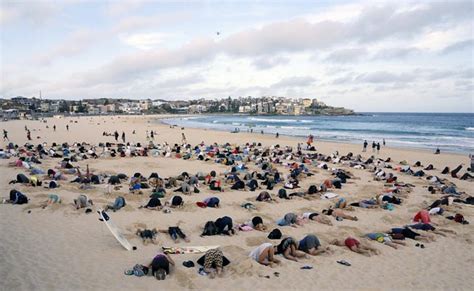 G20 Climate Protesters Bury Heads In Bondi Sands In Australia