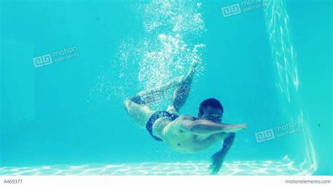 Handsome Man Swimming Towards Camera Underwater Stock Video Footage