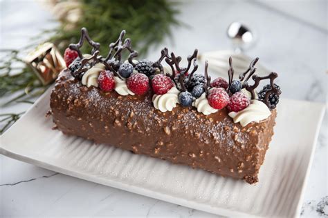 Arrange christmas greens, plastic holly, and meringue mushrooms around the yule log. Yule Log | Desserts, Christmas cooking, Gourmet glaze