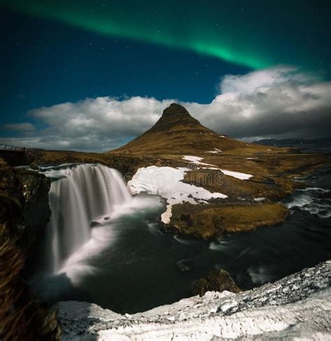 Northern Lights Aurora Borealis Appear Over Mount Kirkjufell In Iceland