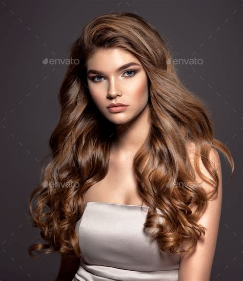 Young Brown Haired Woman With Long Curly Hair Stock Photo By Valuavitaly