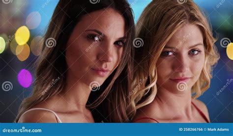Attractive Couple Of Girls Posing With Confidence On Colorful